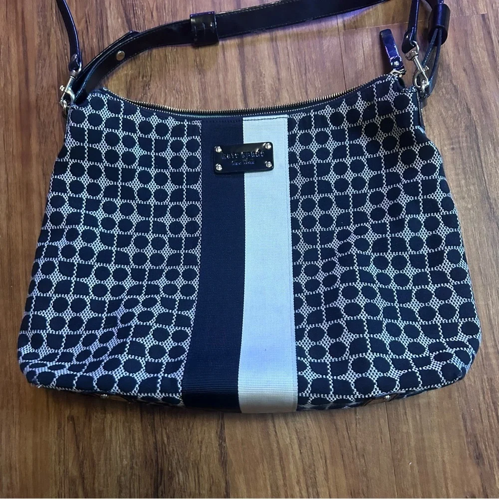 Kate Spade Penn Place Keisha crossbody bag in a black and white dot pattern
